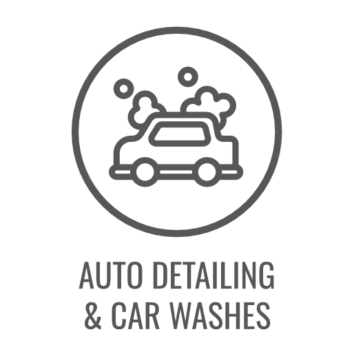 Auto detailing and car wash icon featuring a car with soap suds inside a circle.