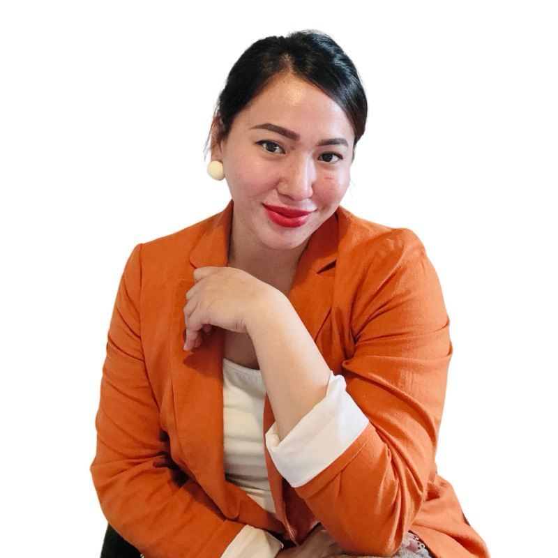 A close up of a woman 's face with a smile on her face