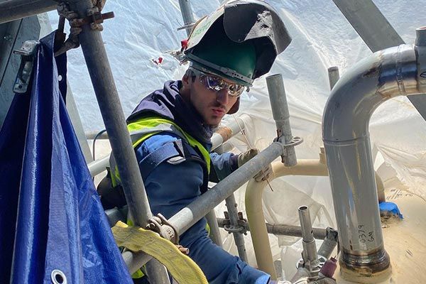 Man Welding on Pipes — Joplin, MO — Darbys Welding