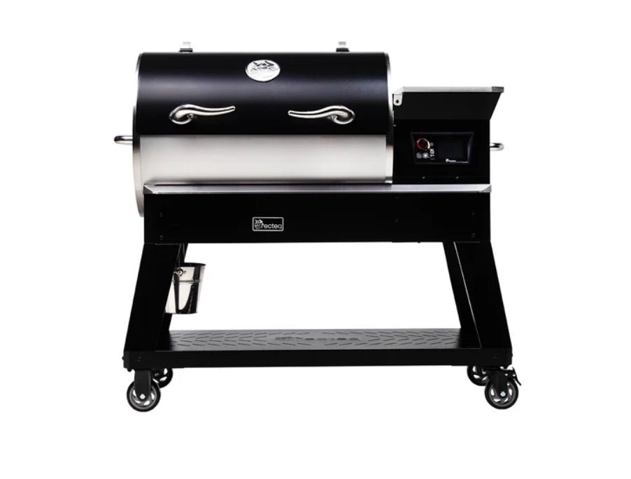 Black and silver pellet grill with a side shelf, on a black stand with wheels.