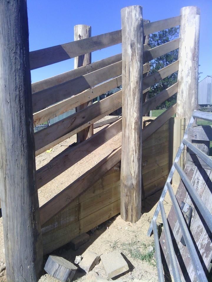 a Wooden Fence With a Metal Fence Behind It — Tony Sinclair Fencing In Bucca, NSW