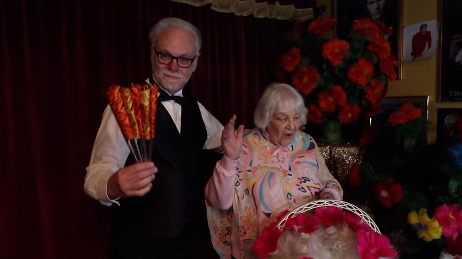 A man and a woman are standing next to each other in a room.