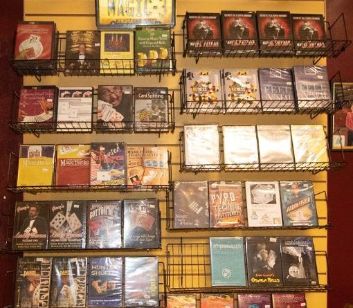 A wall full of dvds including one that says magic