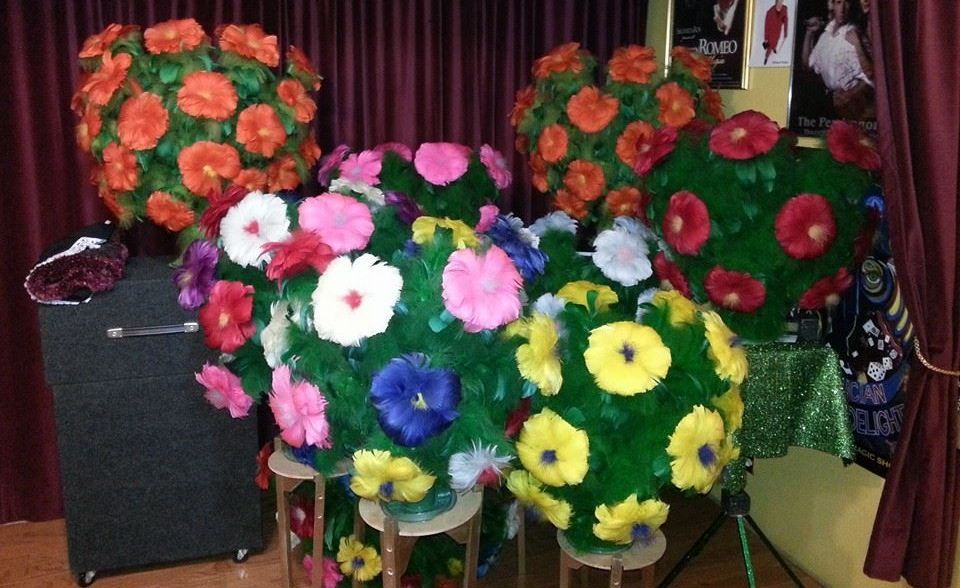 A bunch of flowers are sitting on a table in a room