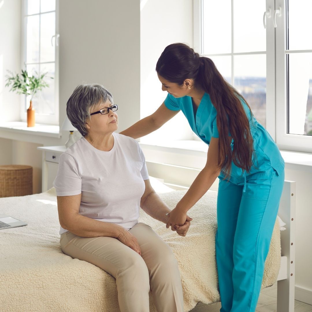 nurse caring for elderly woman