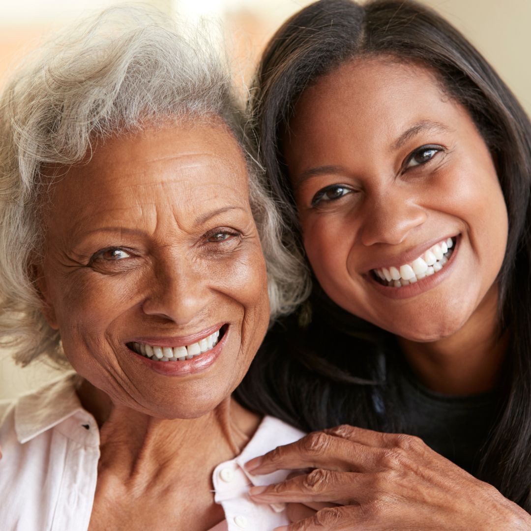 Senior and woman smiling