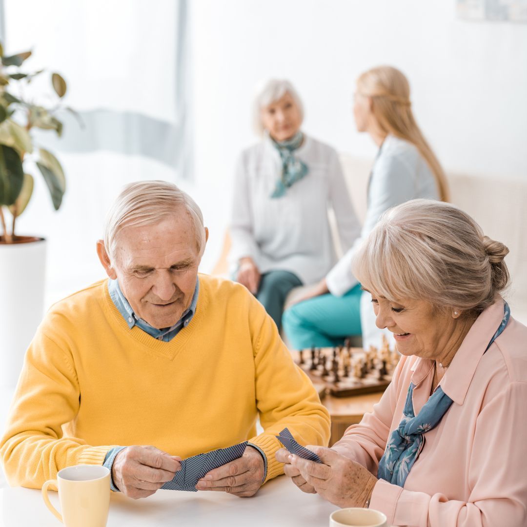 senior couple playing cards