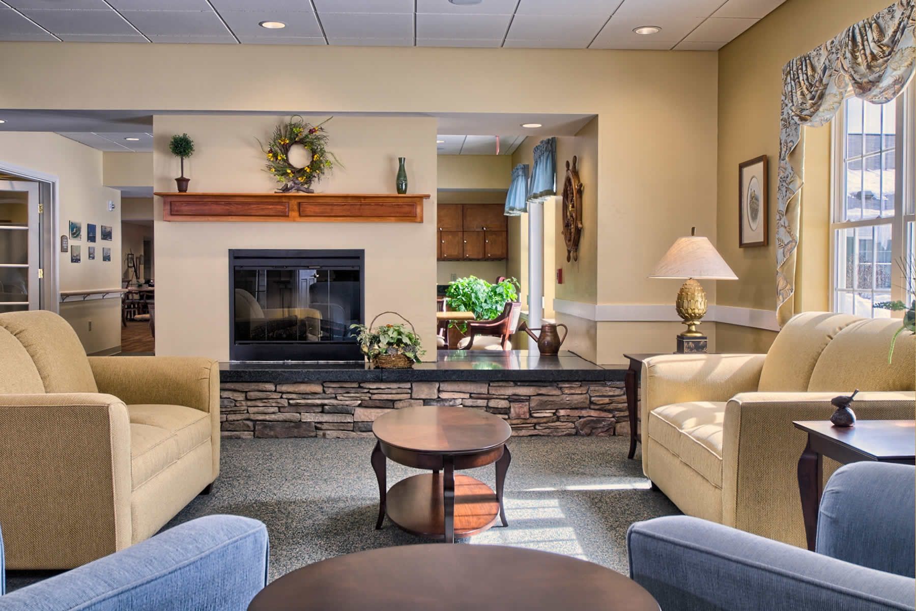 A living room filled with furniture and a fireplace