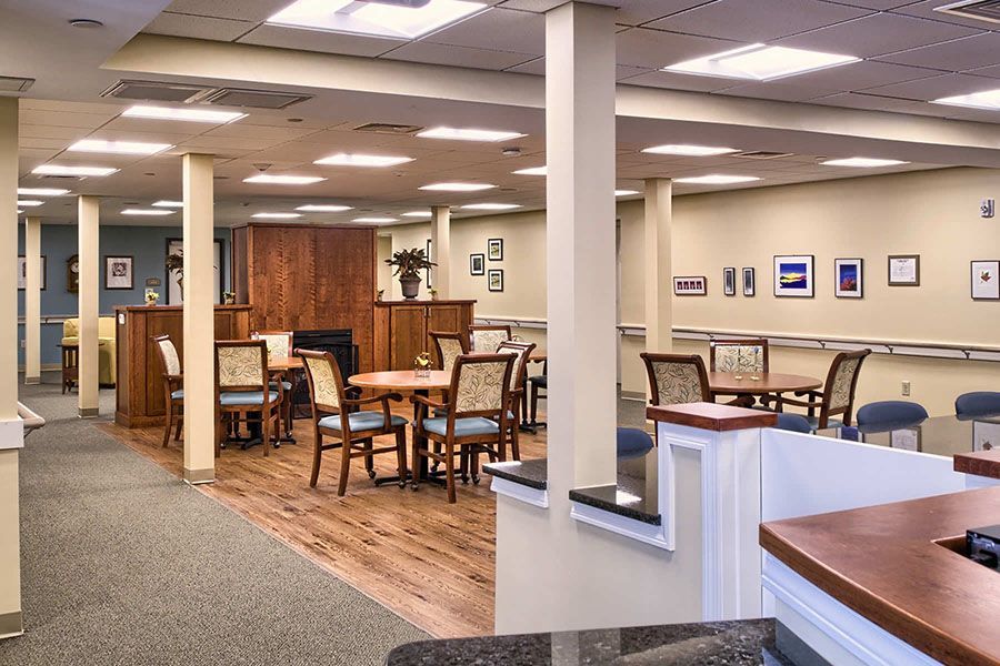 A large room with tables and chairs in it