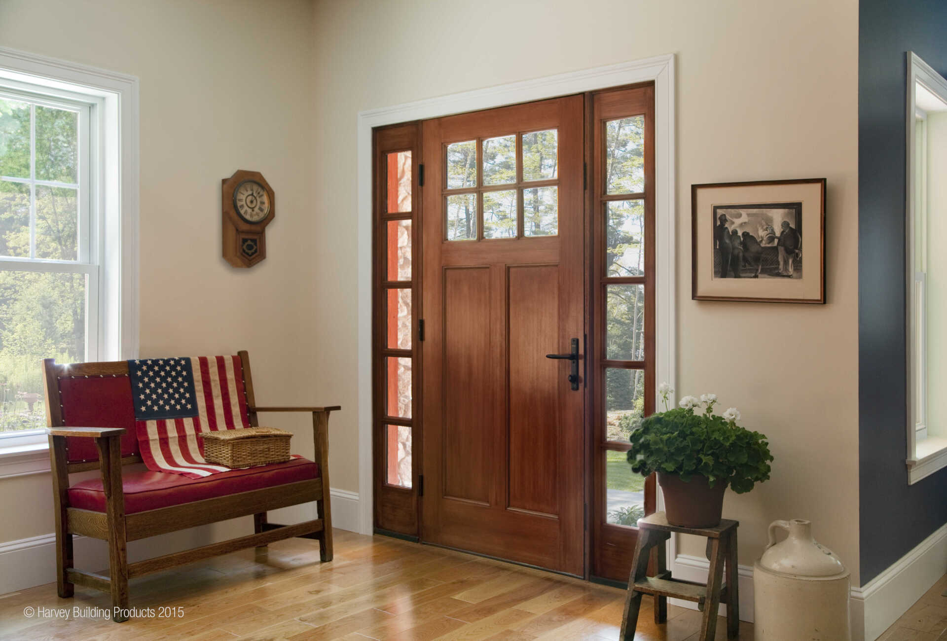 A living room with a wooden bench and a wooden door.