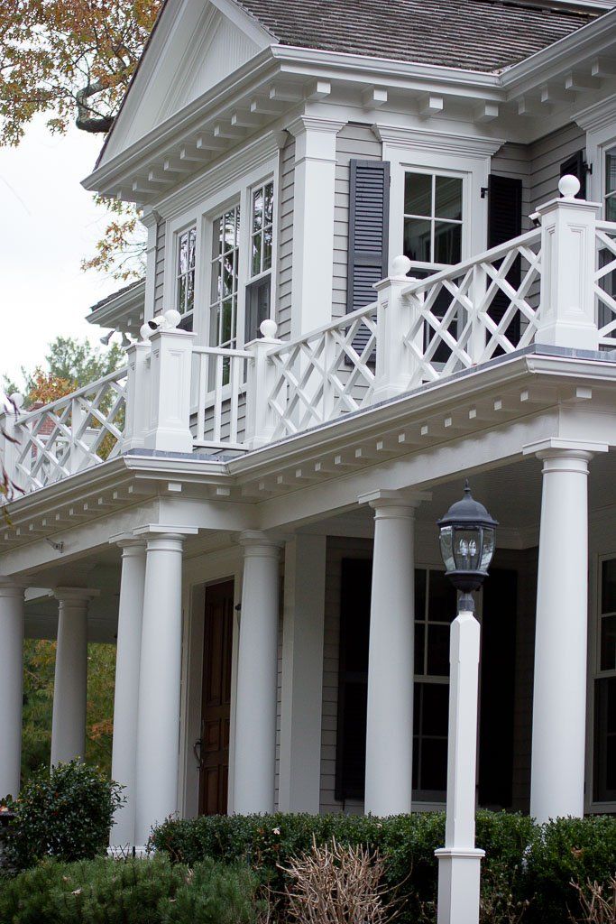 A large white house with a porch and columns