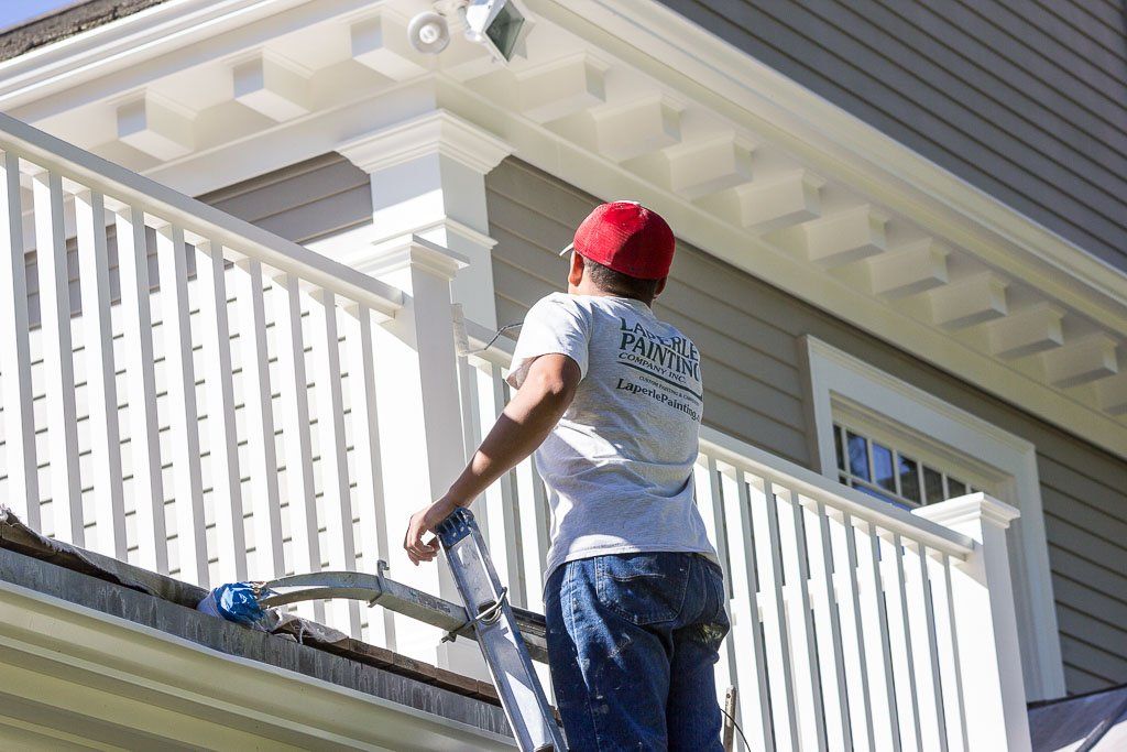 Painter maintaining home exterior