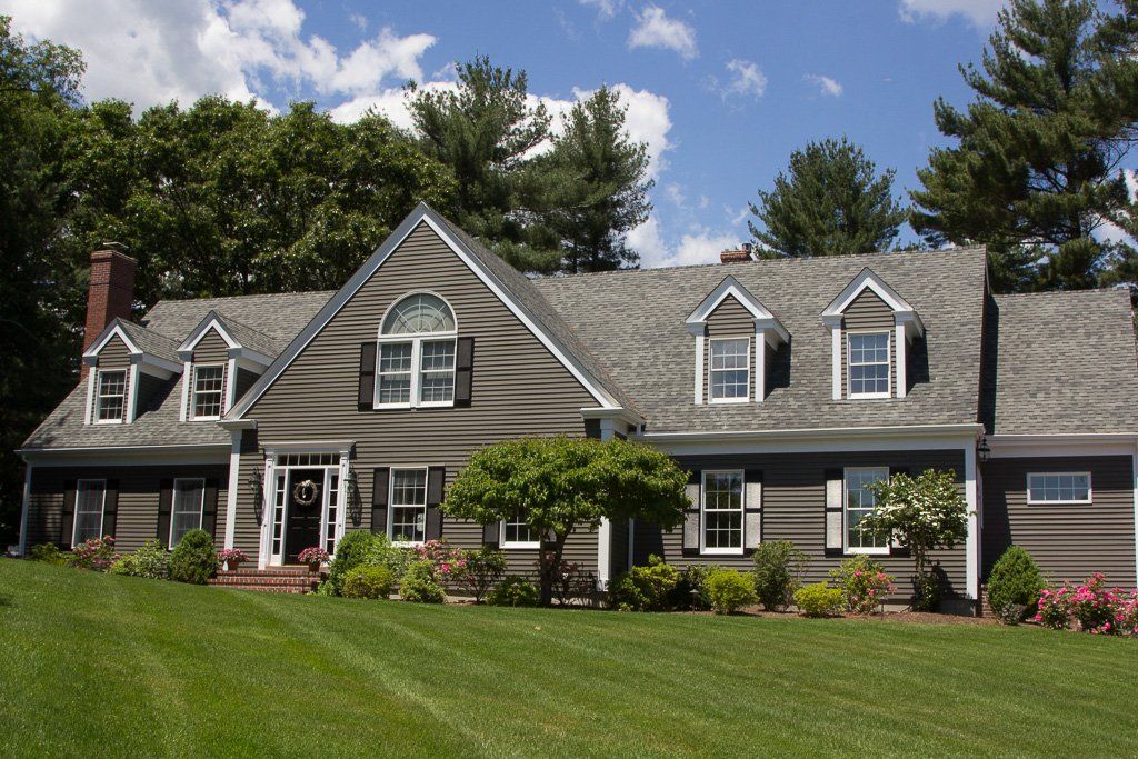 A large house with a large lawn in front of it