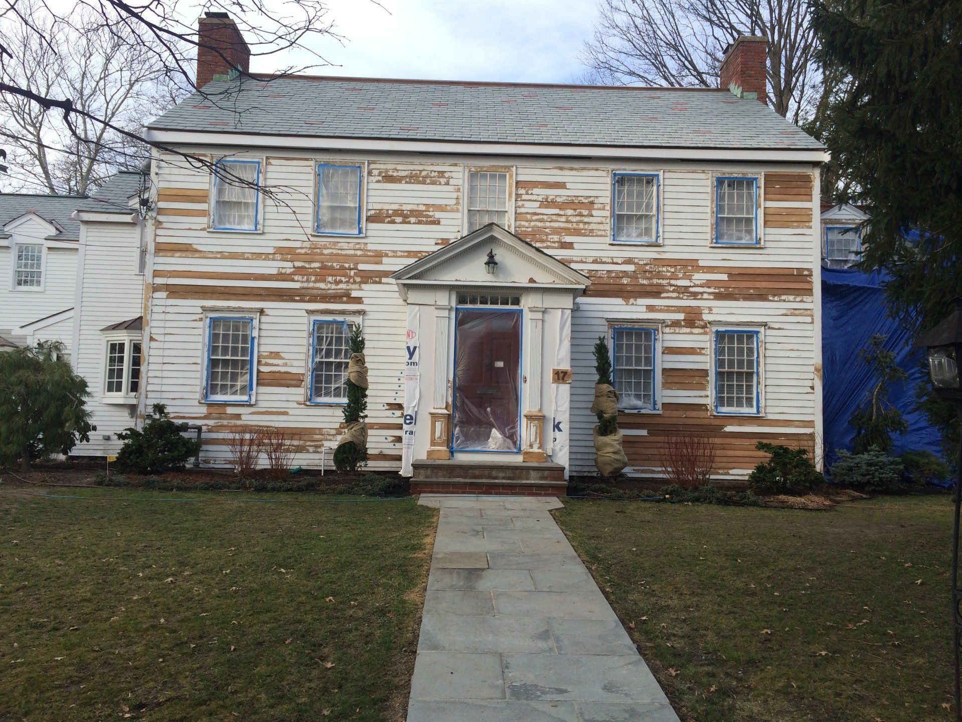 A large white house with a walkway leading to it