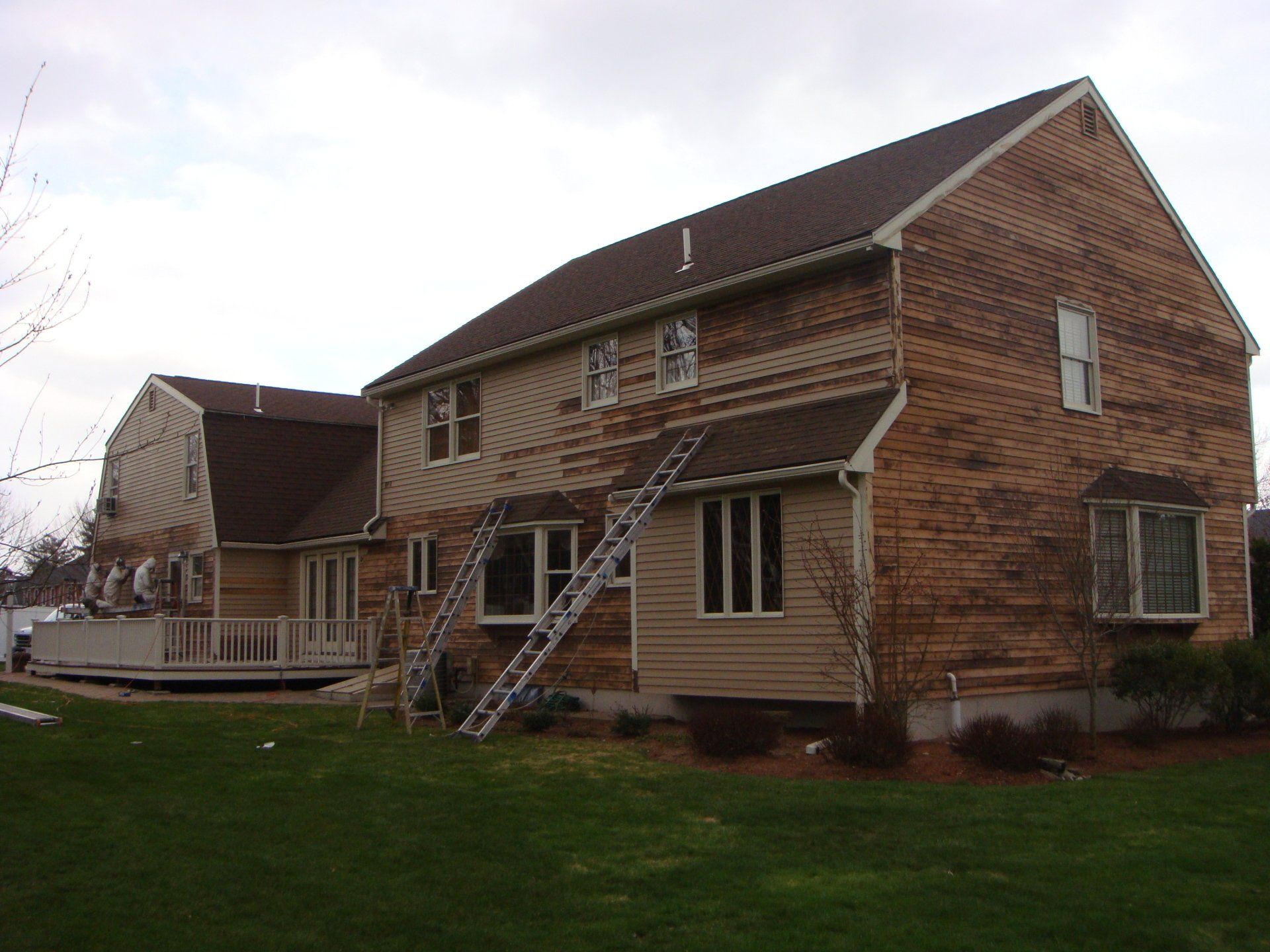 A house with a ladder on the side of it