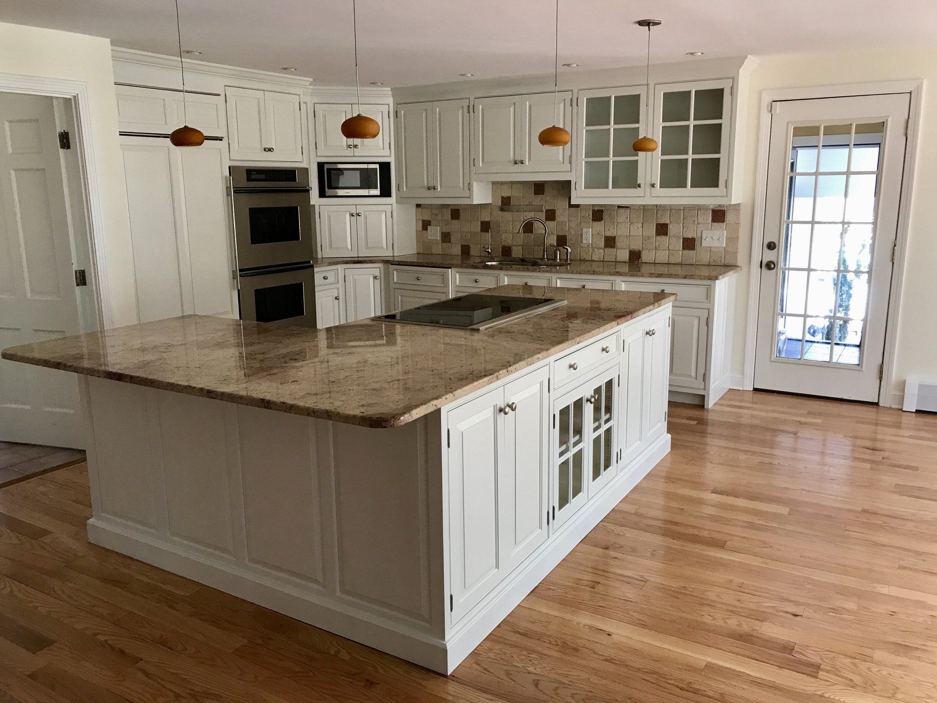 There is a large island in the middle of the kitchen.