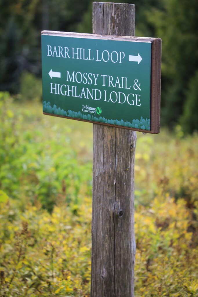 Sign for Barr Hill Natural Area with The Nature Conservancy logo.