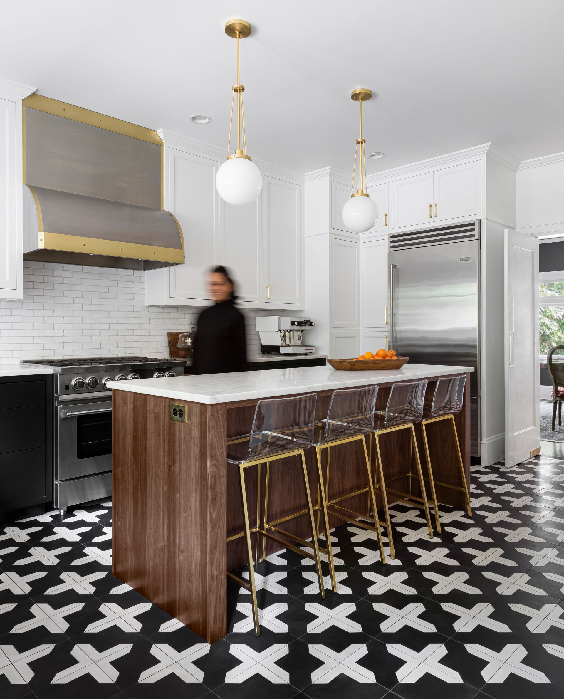 The Arciform cabinets and island frame a beautiful, timeless palette.