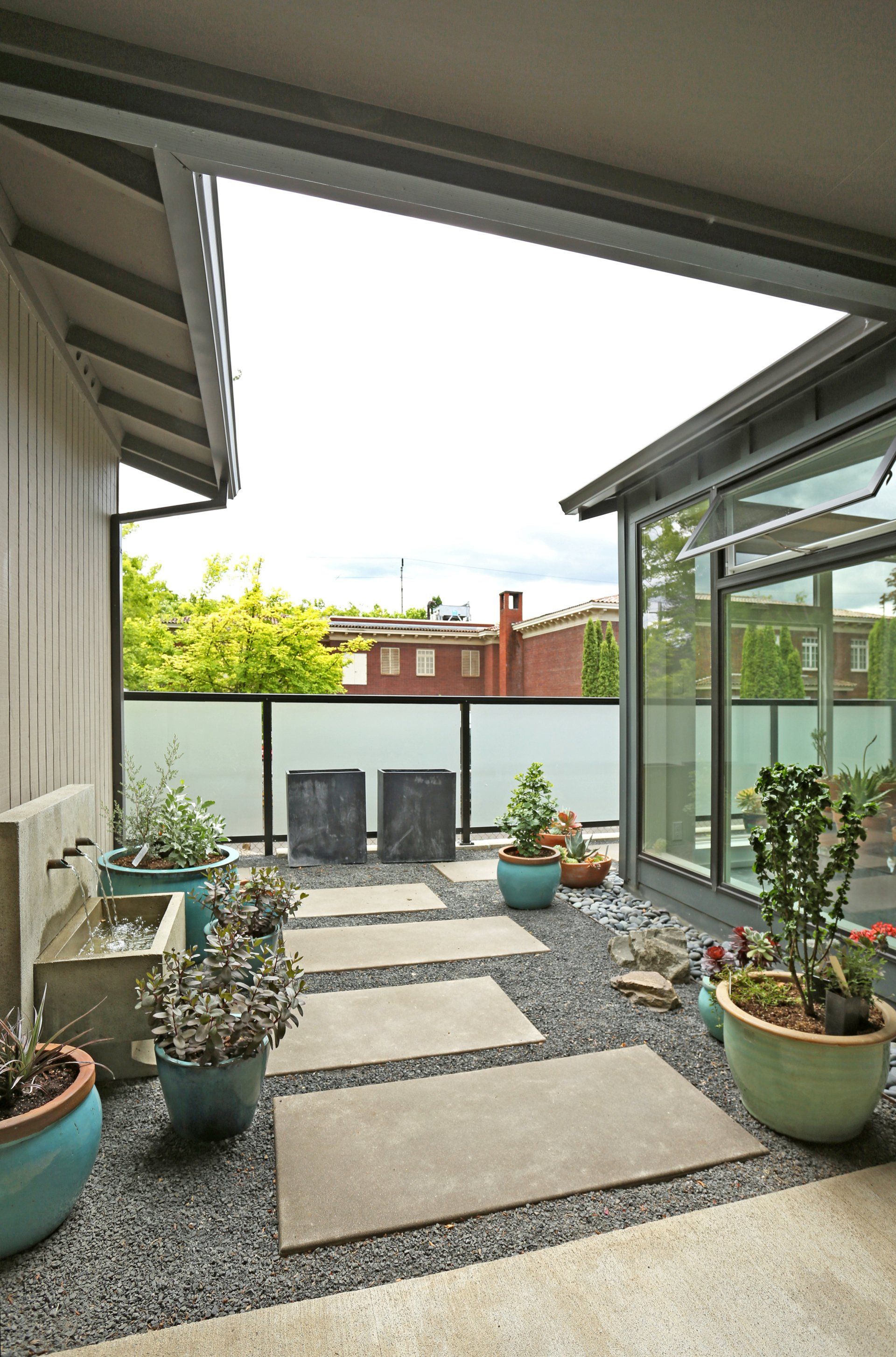 Outside in the space between the new studio addition and the main house