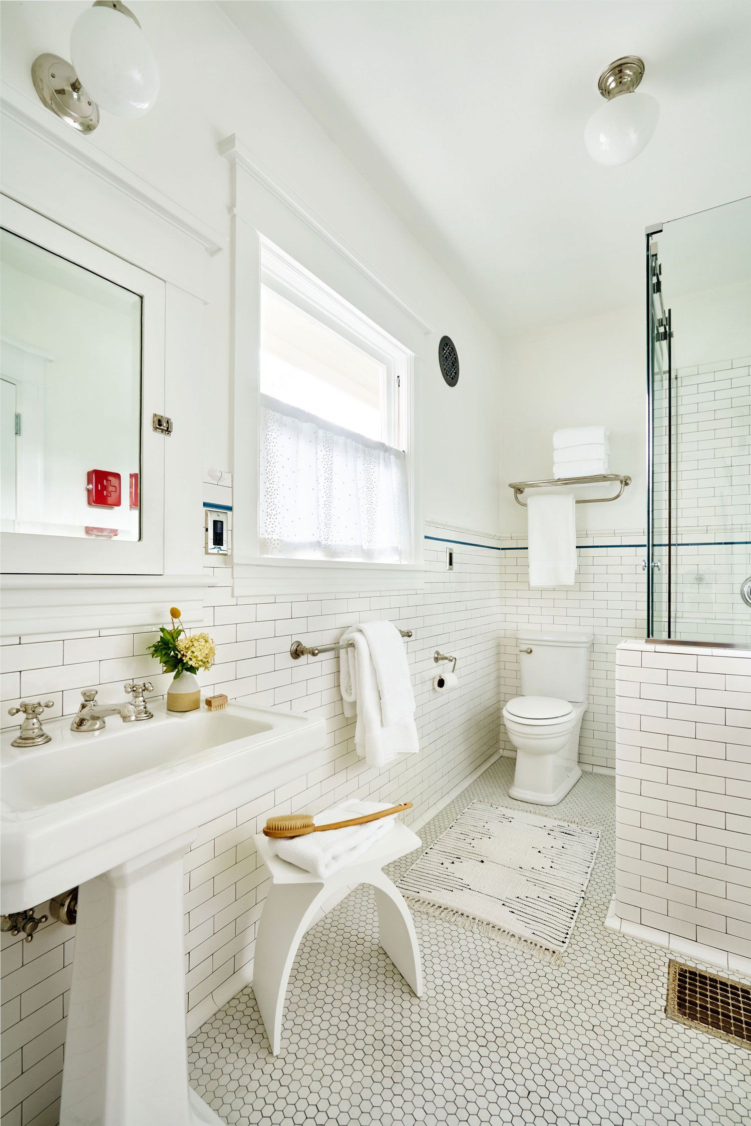 In the main floor bath, we replaced the tub with a shower and installed all new wall tile.