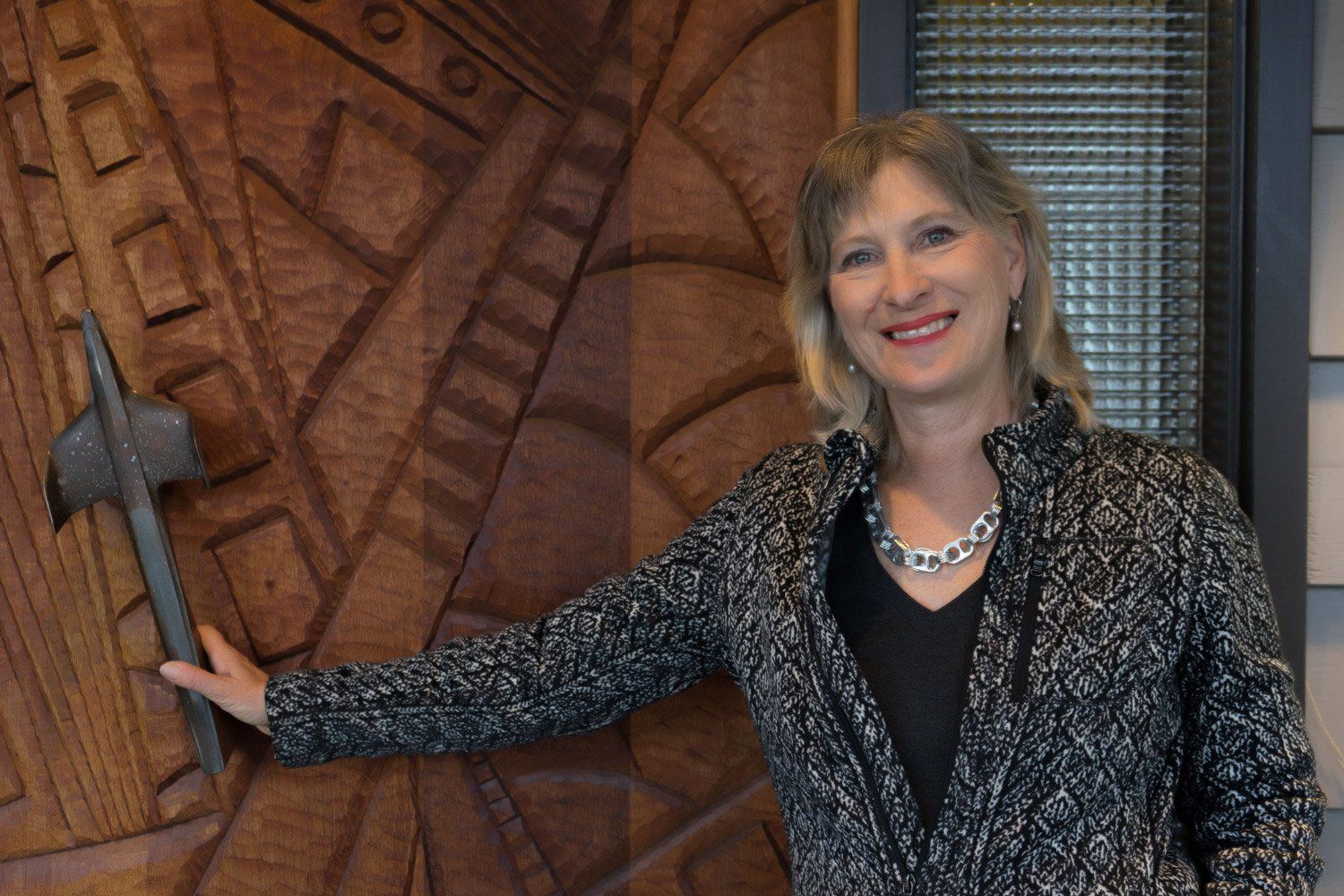 The front door was carved by Tom Cramer. It is Honduras Mahogany with a 1954 Chevy Bel Air hood ornament handle.