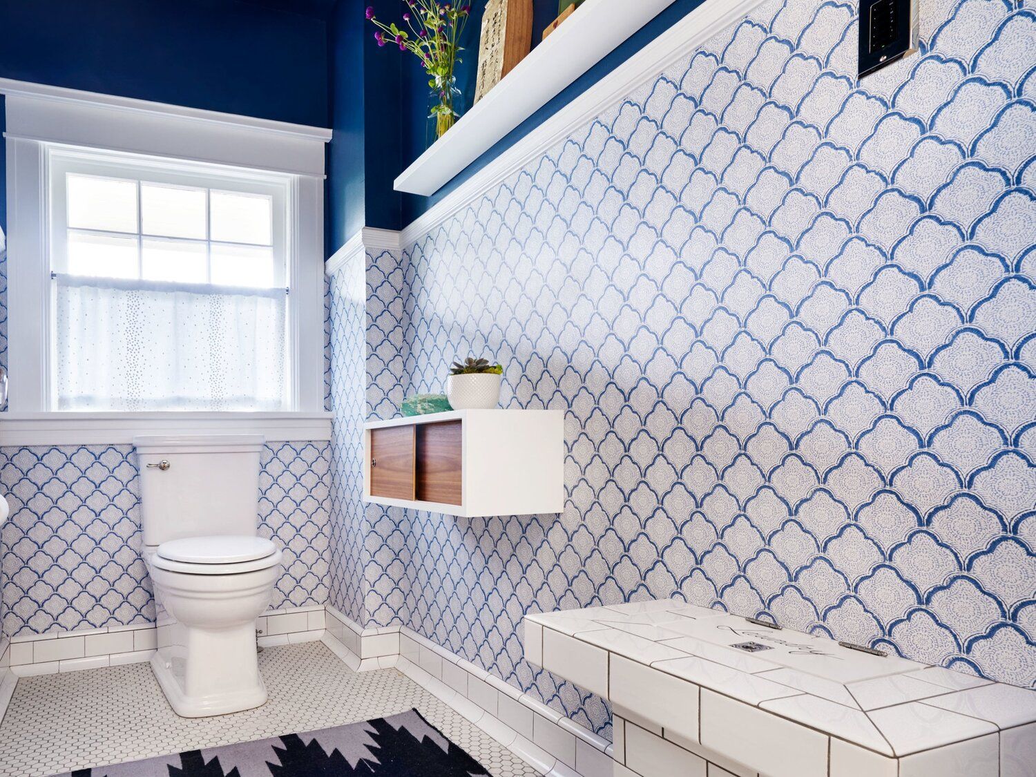 In the second floor bath, we added a second sink, storage and new lights.