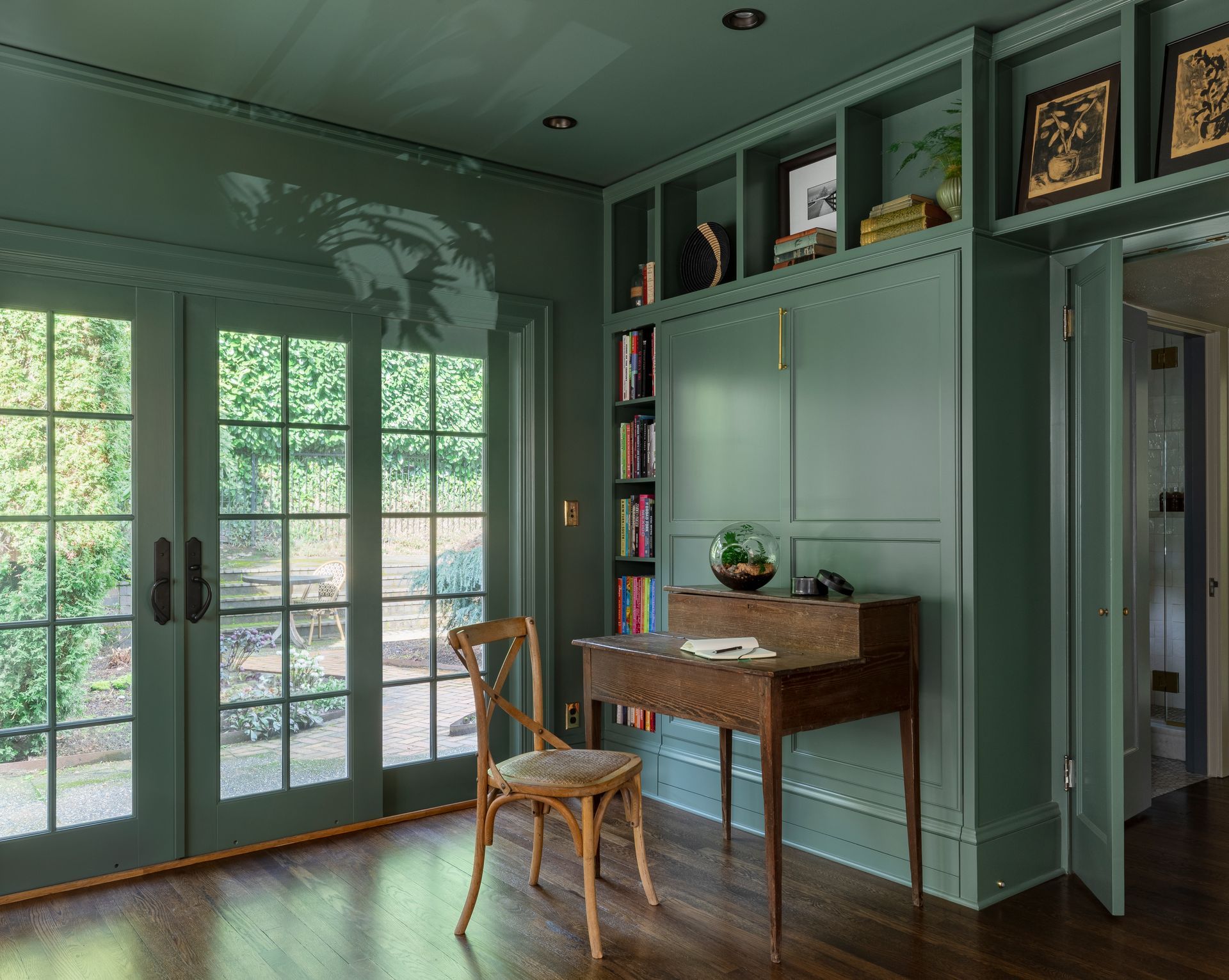 The room hugs you in comforting greens, inside and out, whether you're reading, studying or resting.