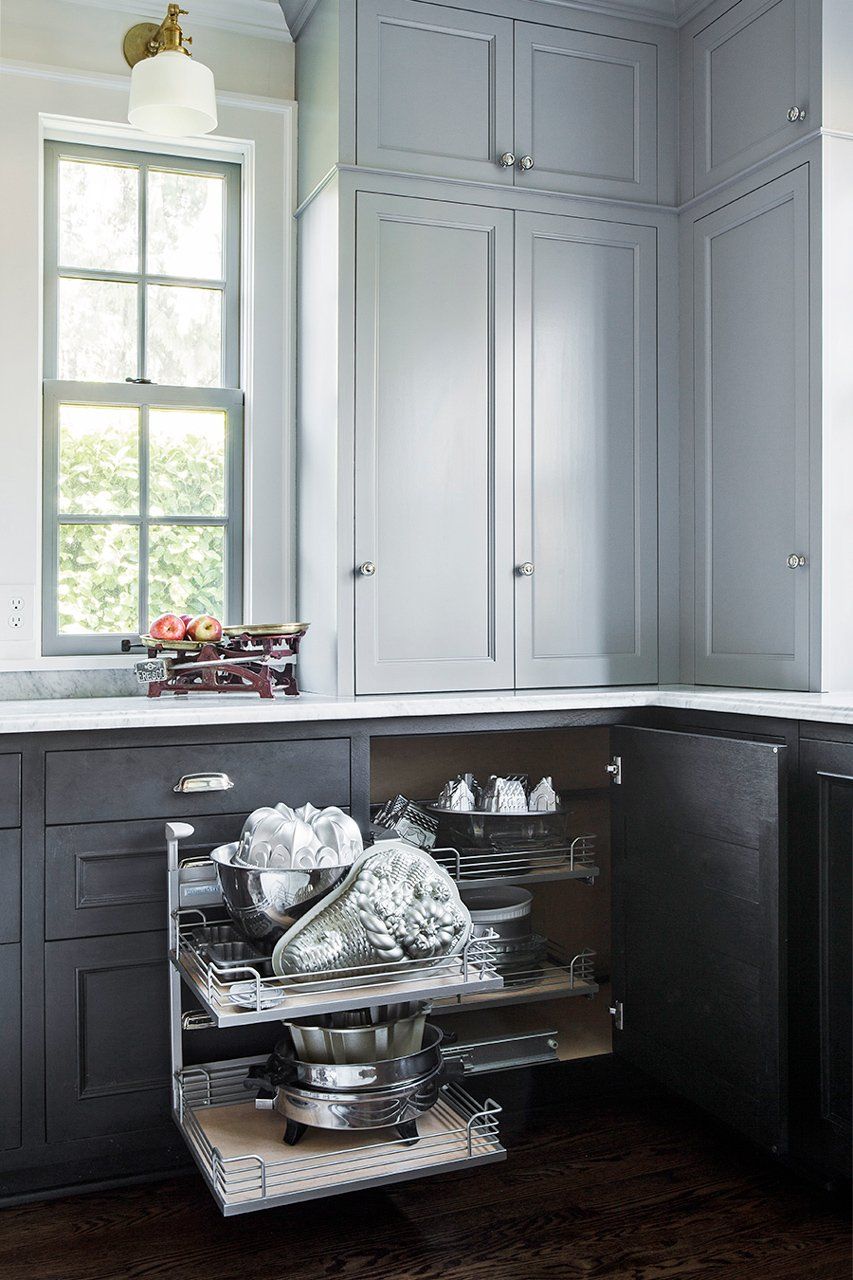 Small appliances, pots and pans are neatly pulled out from the corner cabinet thanks to the Magic Corner insert.