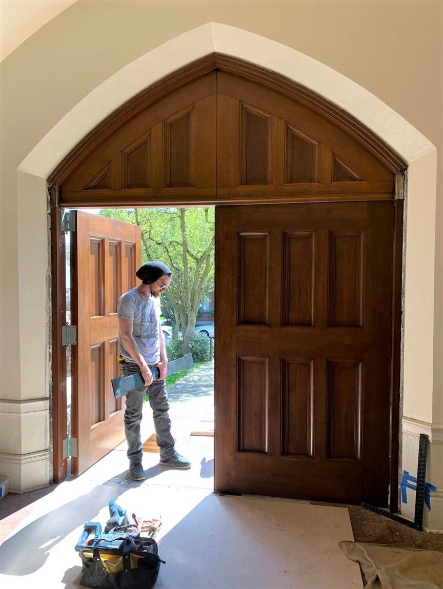 Our Arciform crew installed the finished doors in the Gothic arched entryway.