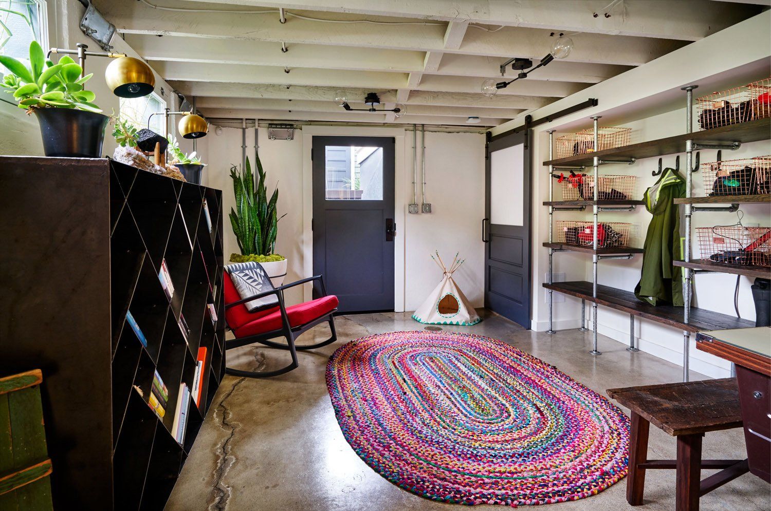 The entire basement was remodeled. The concrete floors were sealed and walls were painted white to maximize light and create a modern-industrial vibe.