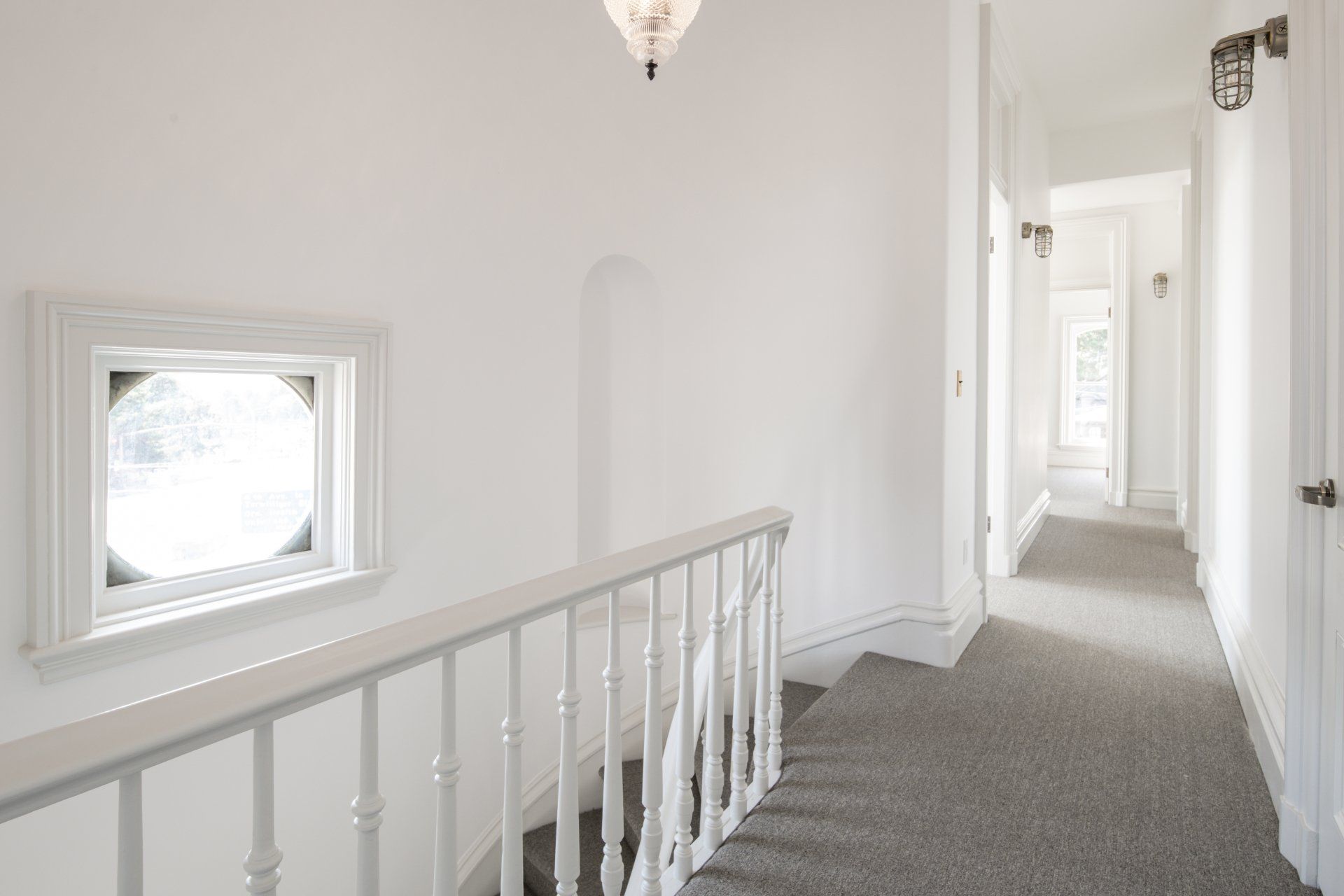 Our team restored original features like the curved main stairway with niche.