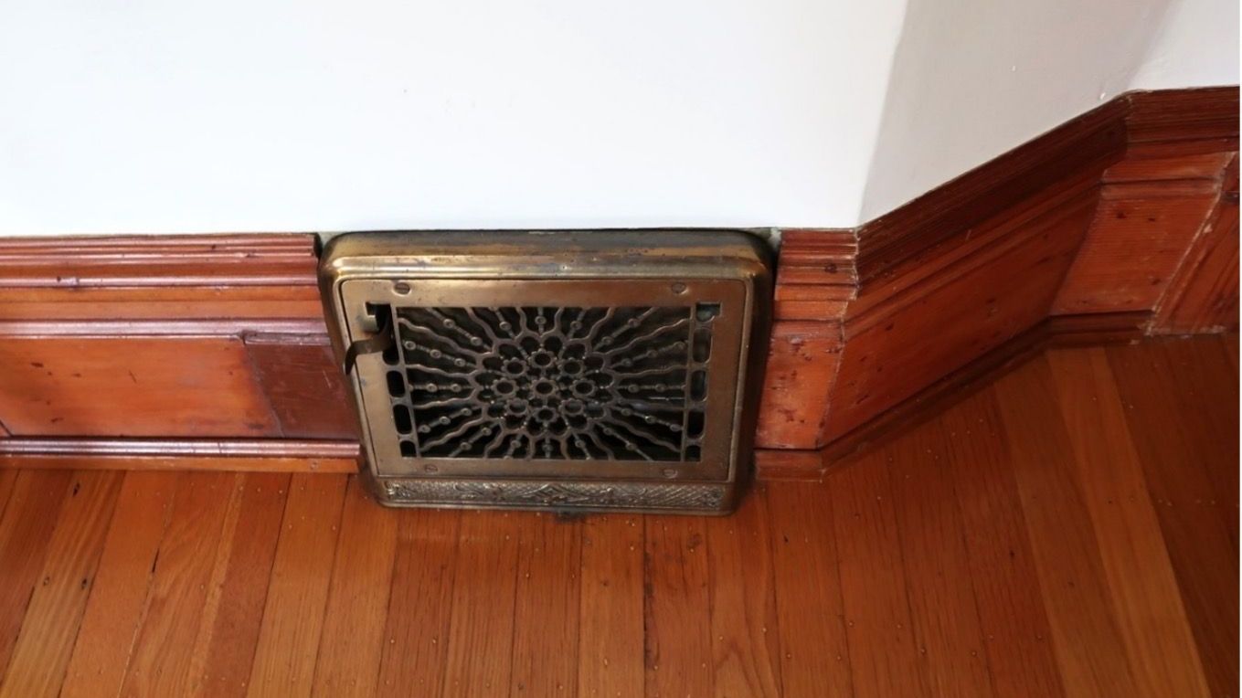 Close up of vintage heating register with unique pattern