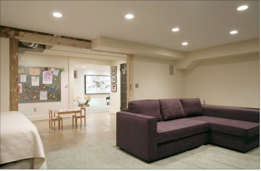 After picture of painted heating ducts in a remodeled basement