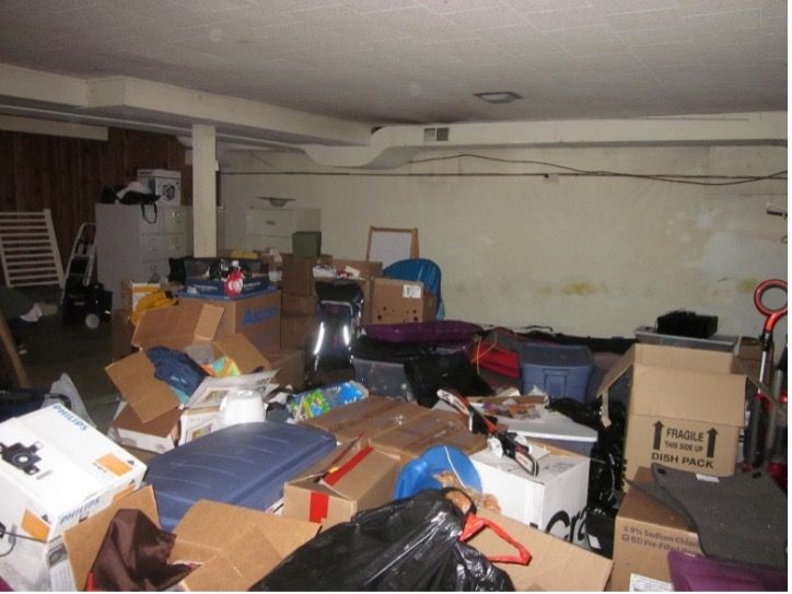 Before picture of heating ducts not painted in a basement