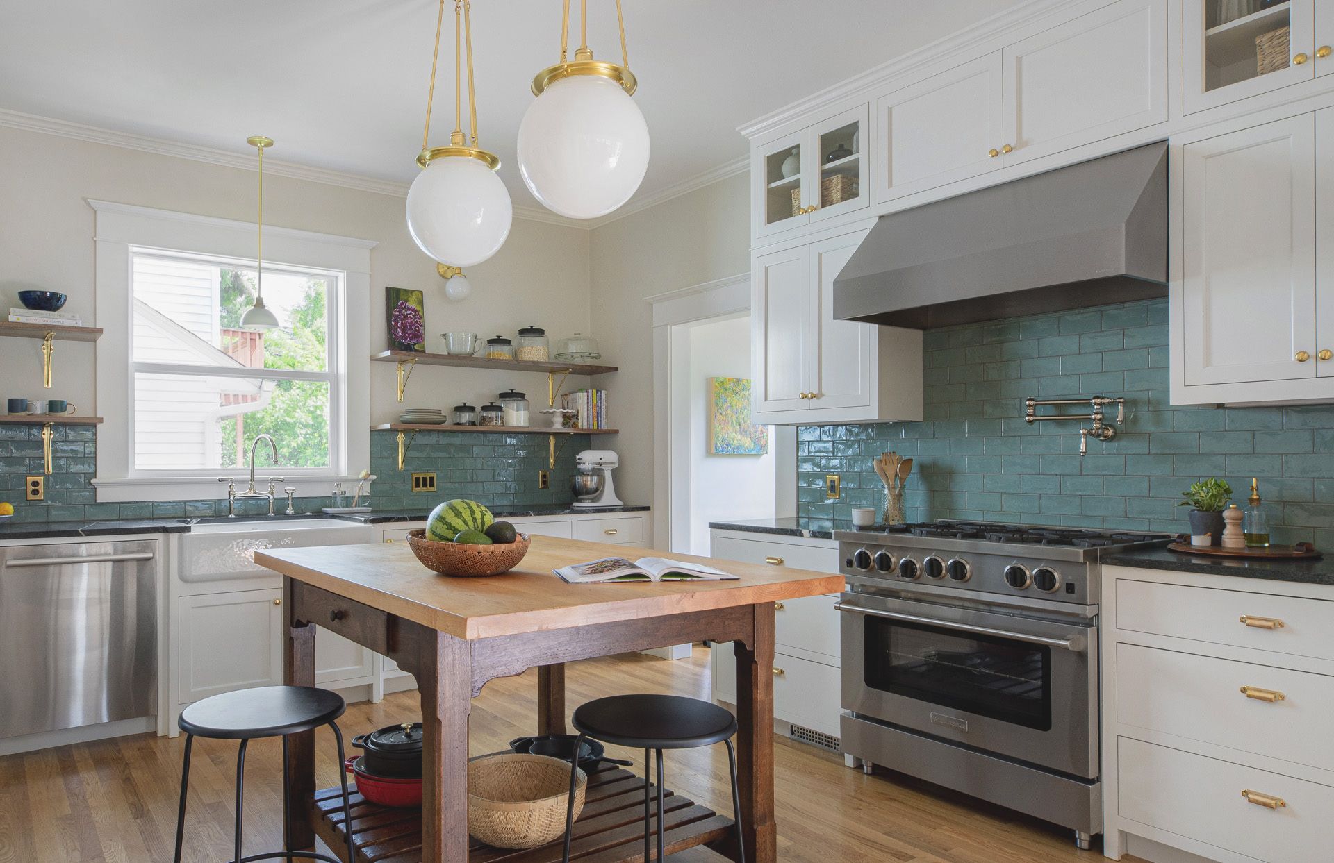 The two-tier fully fitted cabinets in Tracey and Leo's Laurelhurst kitchen harken back to the home's original 1920s style. 