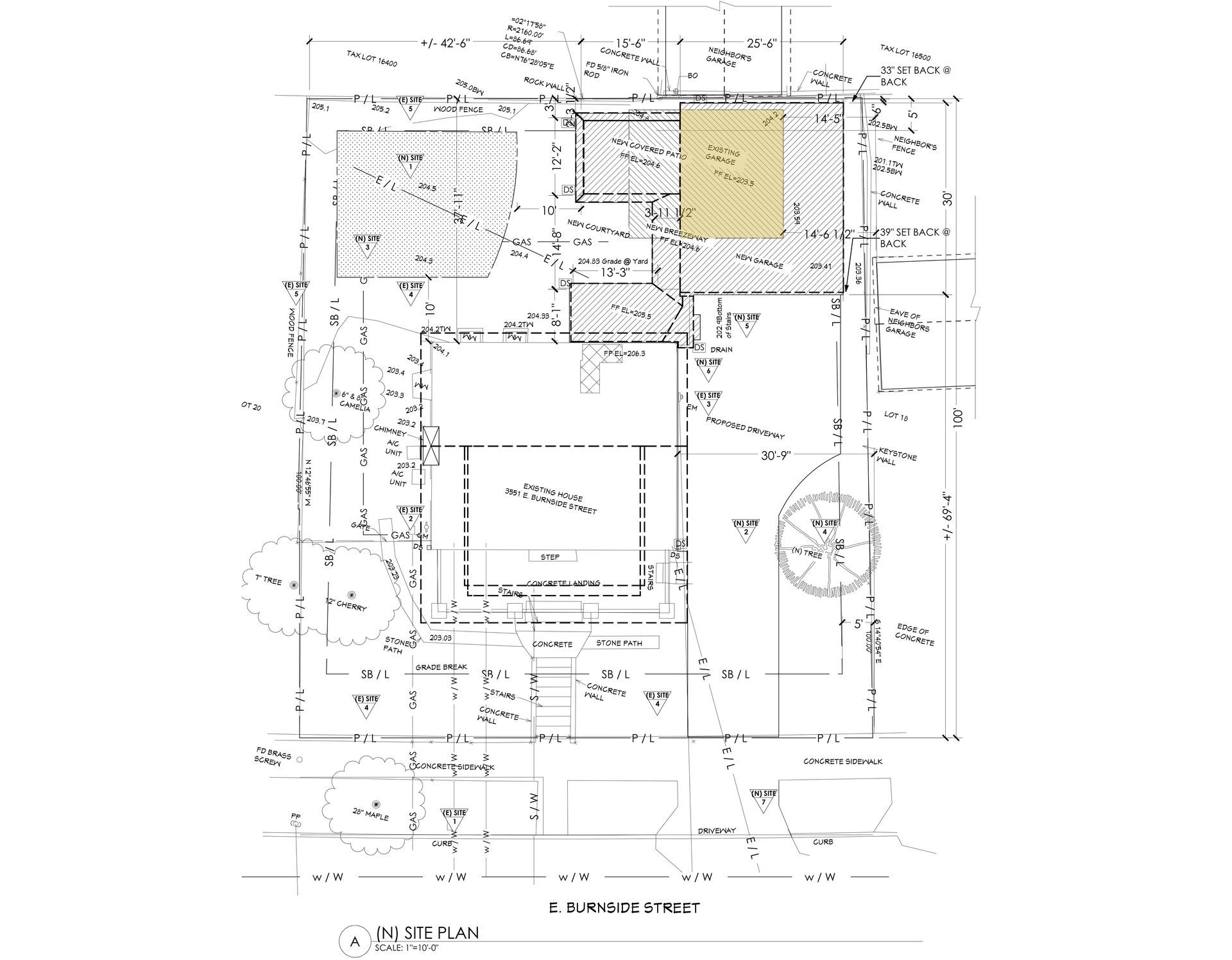 Site plan of Laurelhurst home with new historic style garage and mudroom addition, as well as covered outdoor patio.