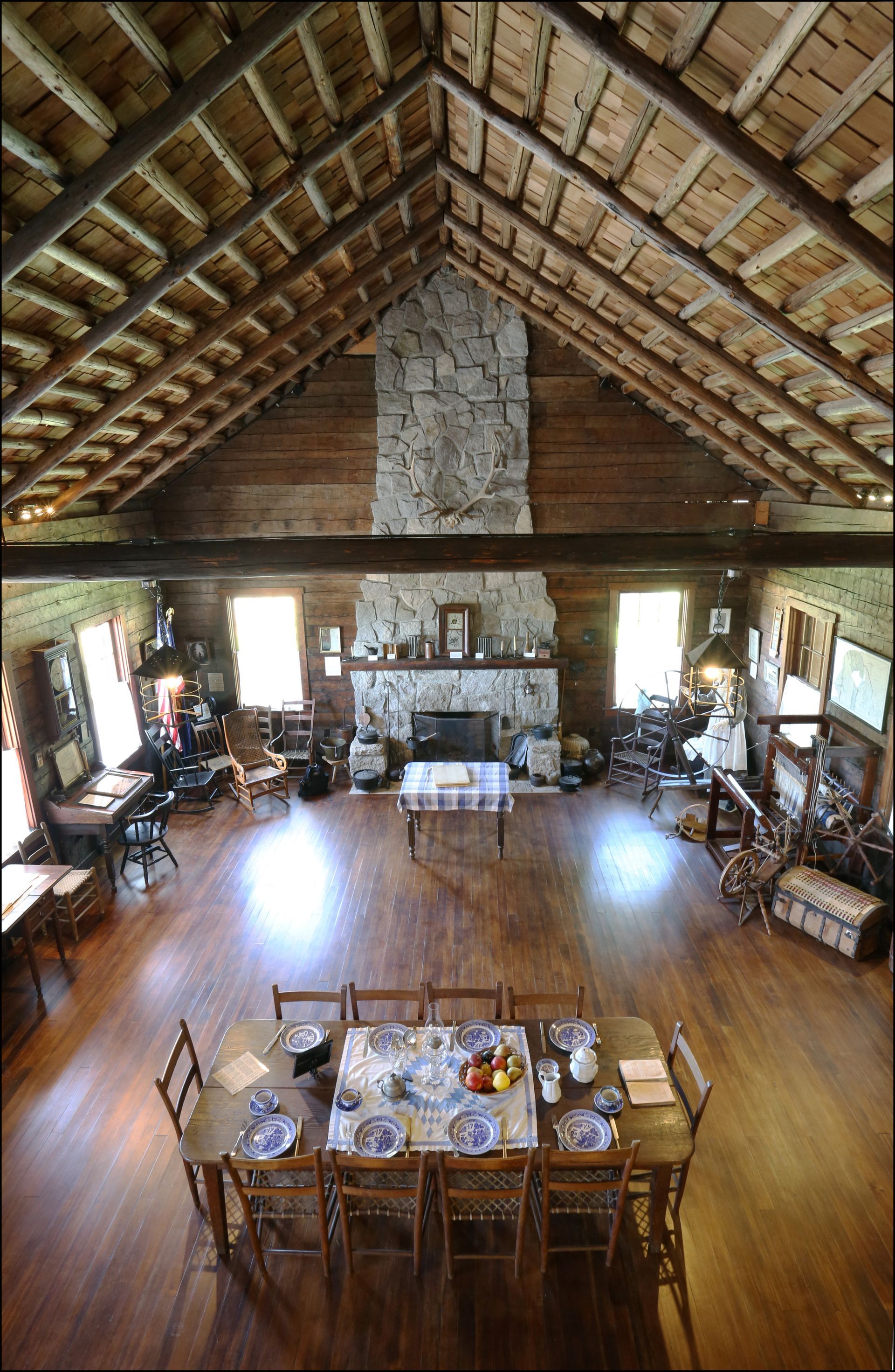 An aerial view of a large room with a table and chairs