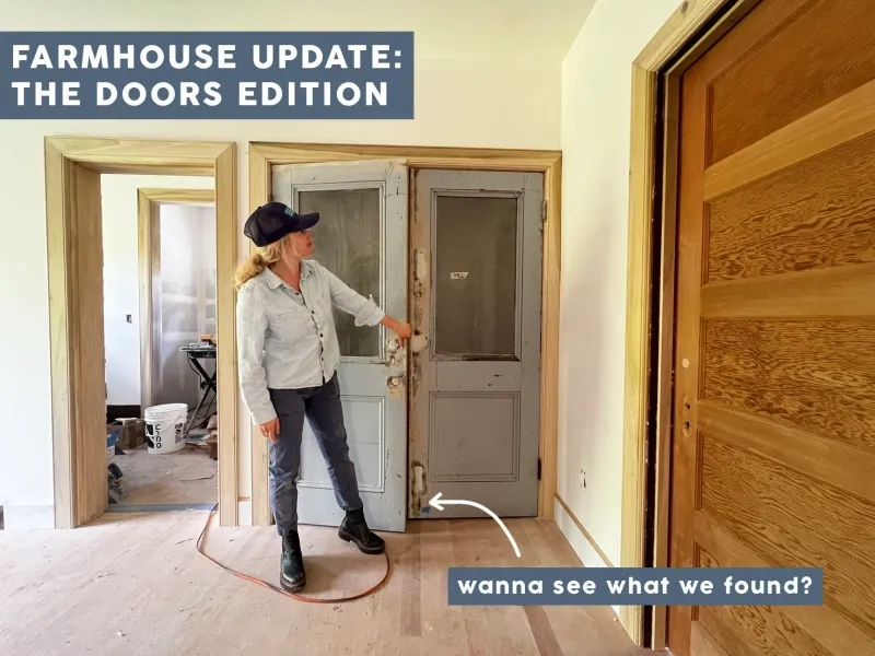 A woman is standing in a room with a sign that says farmhouse update the doors edition