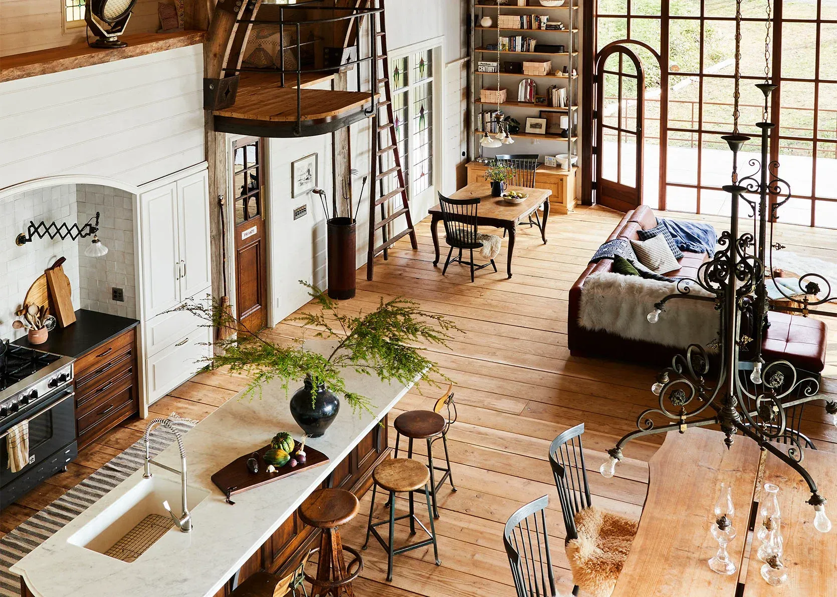 An aerial view of a kitchen dining room and living room