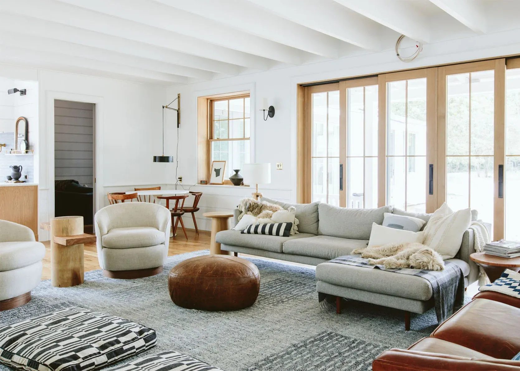 A living room filled with furniture and sliding glass doors.