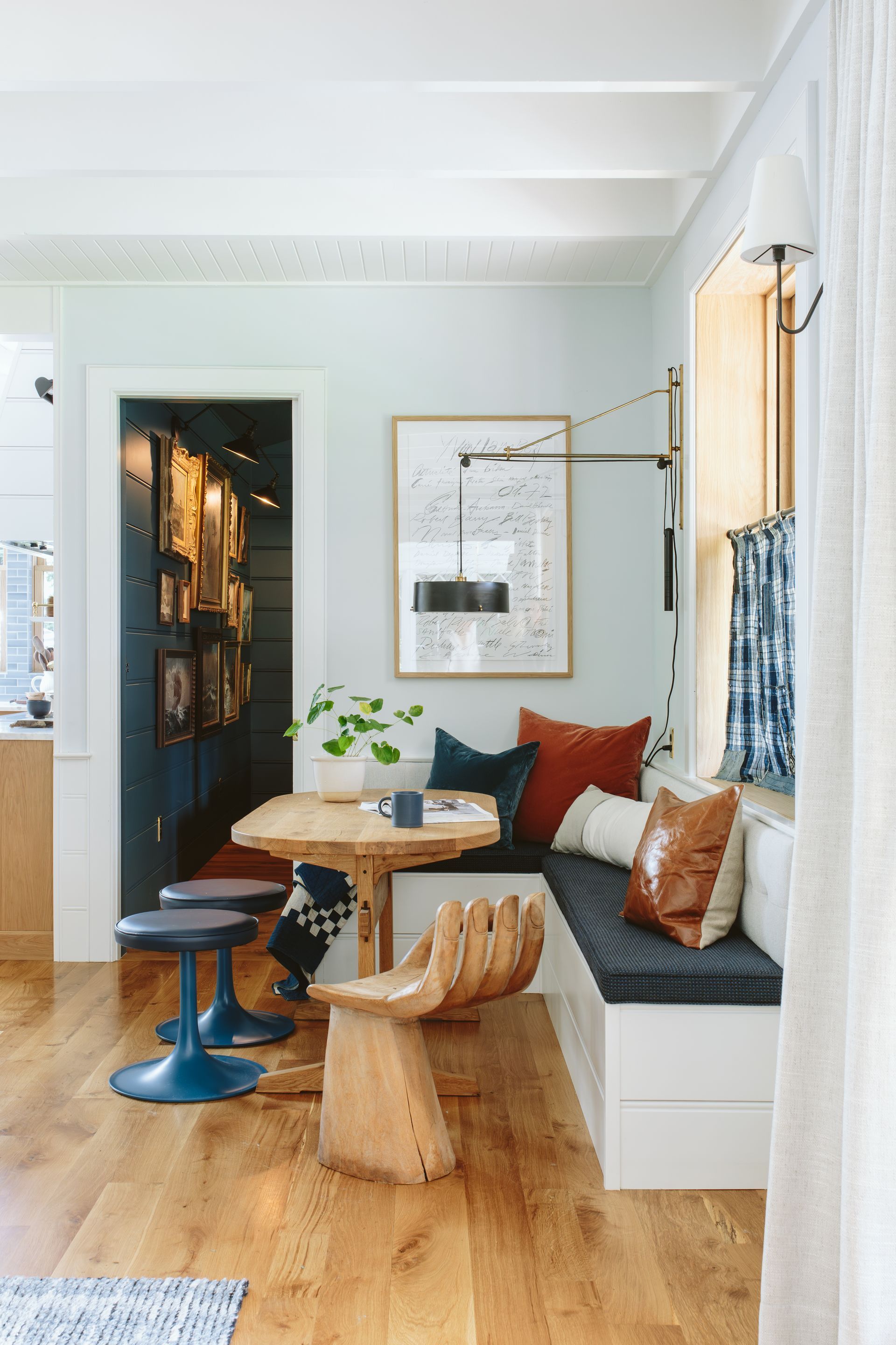 Eating nook with eclectic furnishings, fixtures, and finishes.