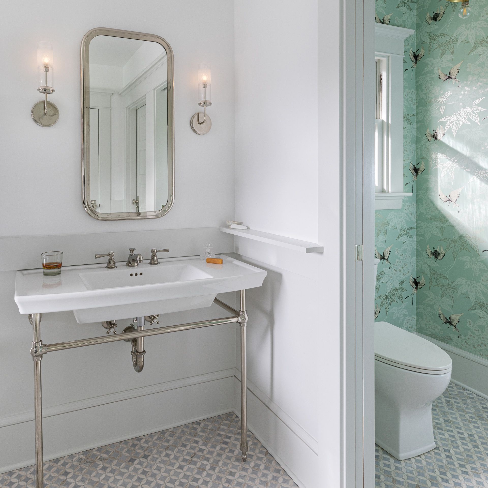 In the 1911 Irvington bathroom shown above, the toilet is located in a former closet - cheerful butterfly-themed wallpaper adds a splash of color.