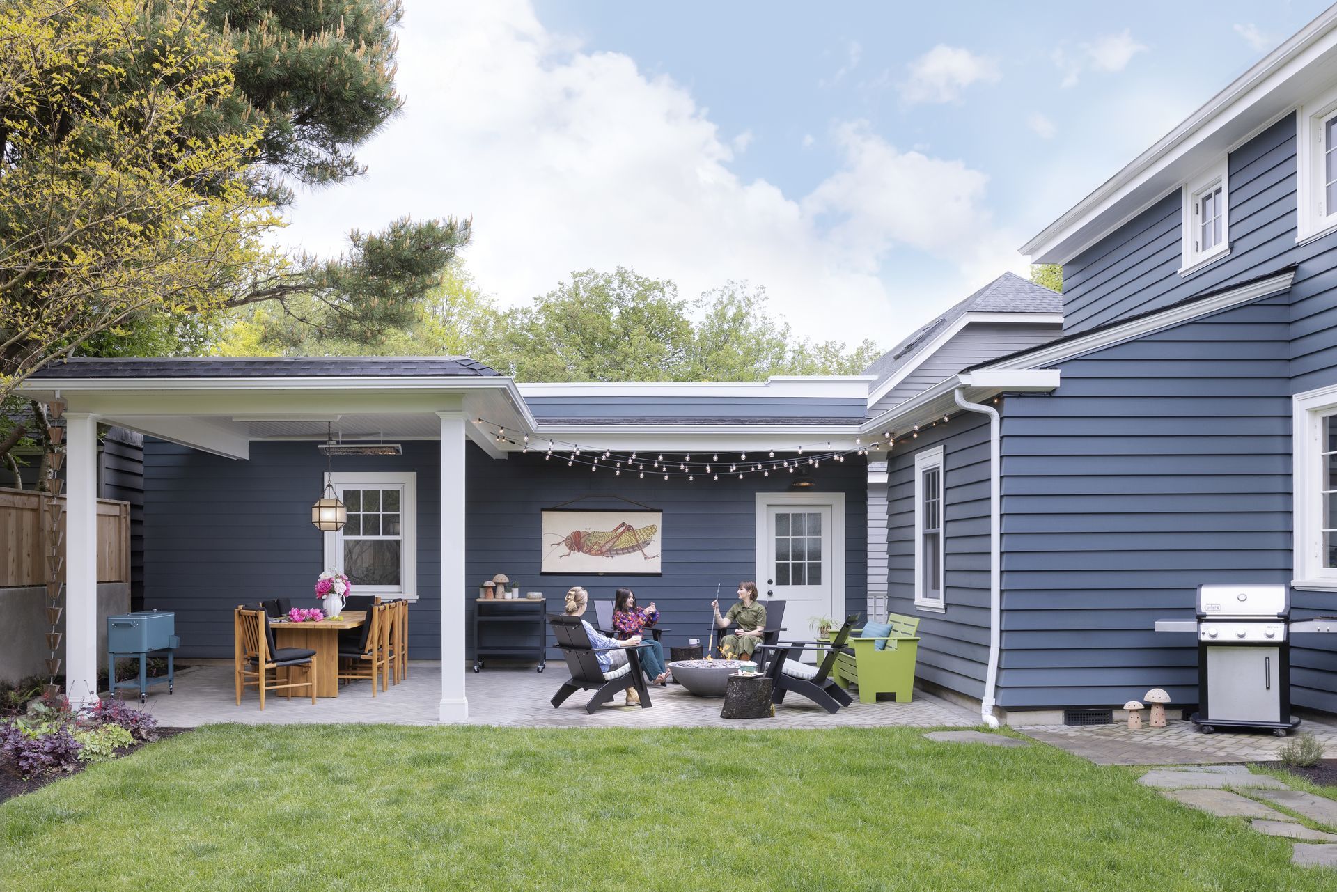 The new garage is connected to the house via a covered breezeway and entry porch. 