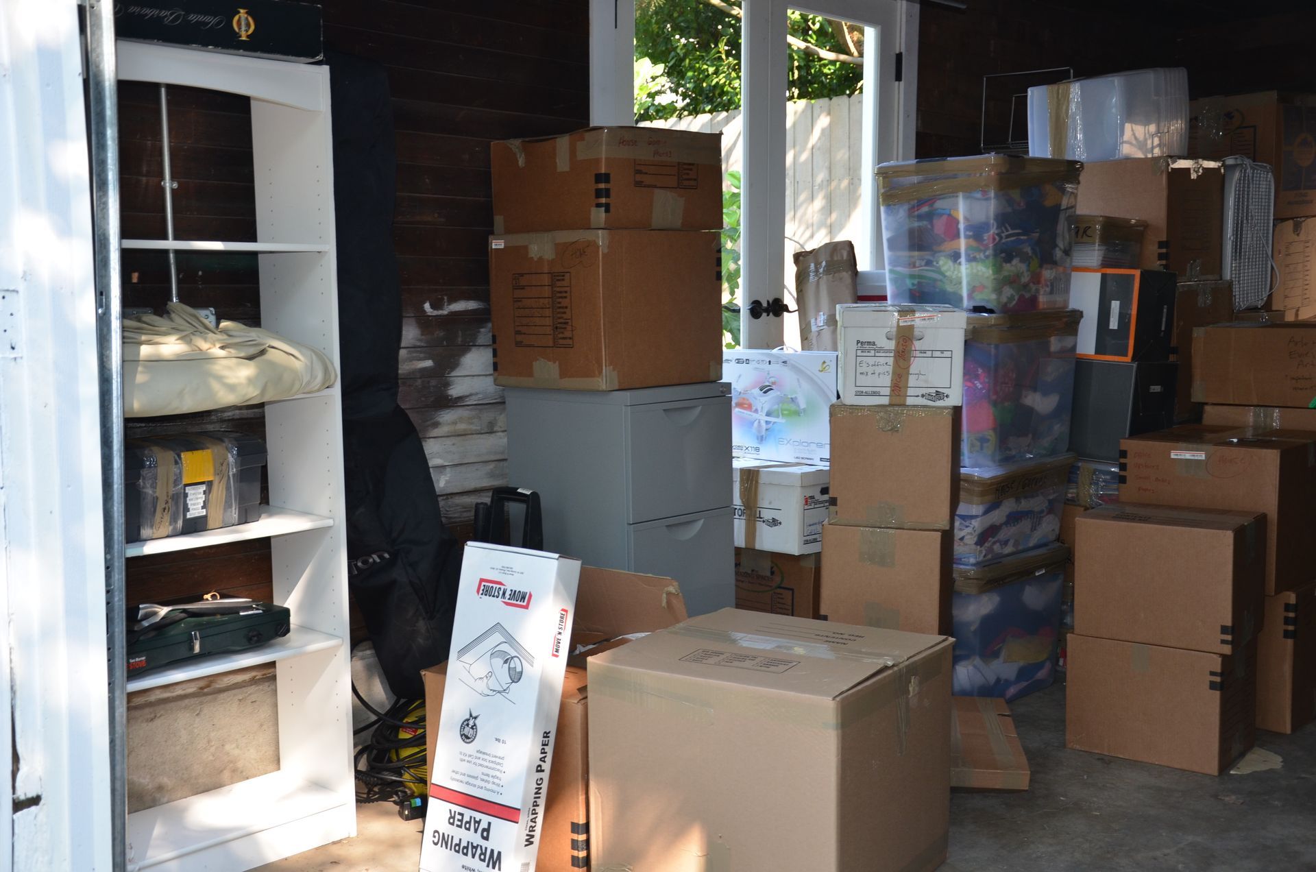 The old garage we replaced was on the verge of falling over and could only house one small car so was delegated to storage only. 