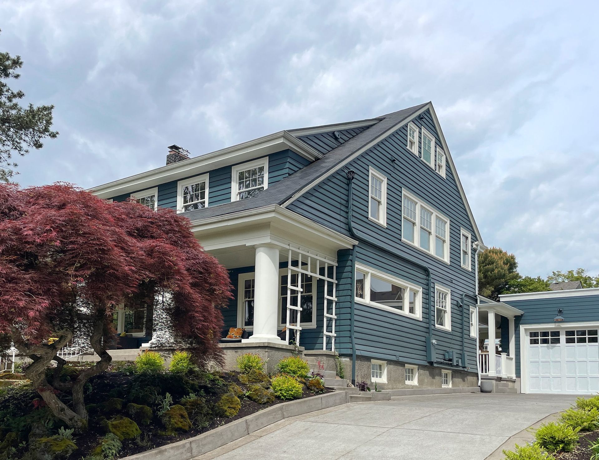 In urban neighborhoods like Laurelhurst neighbors are given the opportunity to offer feedback to any proposed exterior changes or additions. In this case Arciform designed and built a new double car garage and mudroom entry, and altered the driveway, which required extensive historic design review.