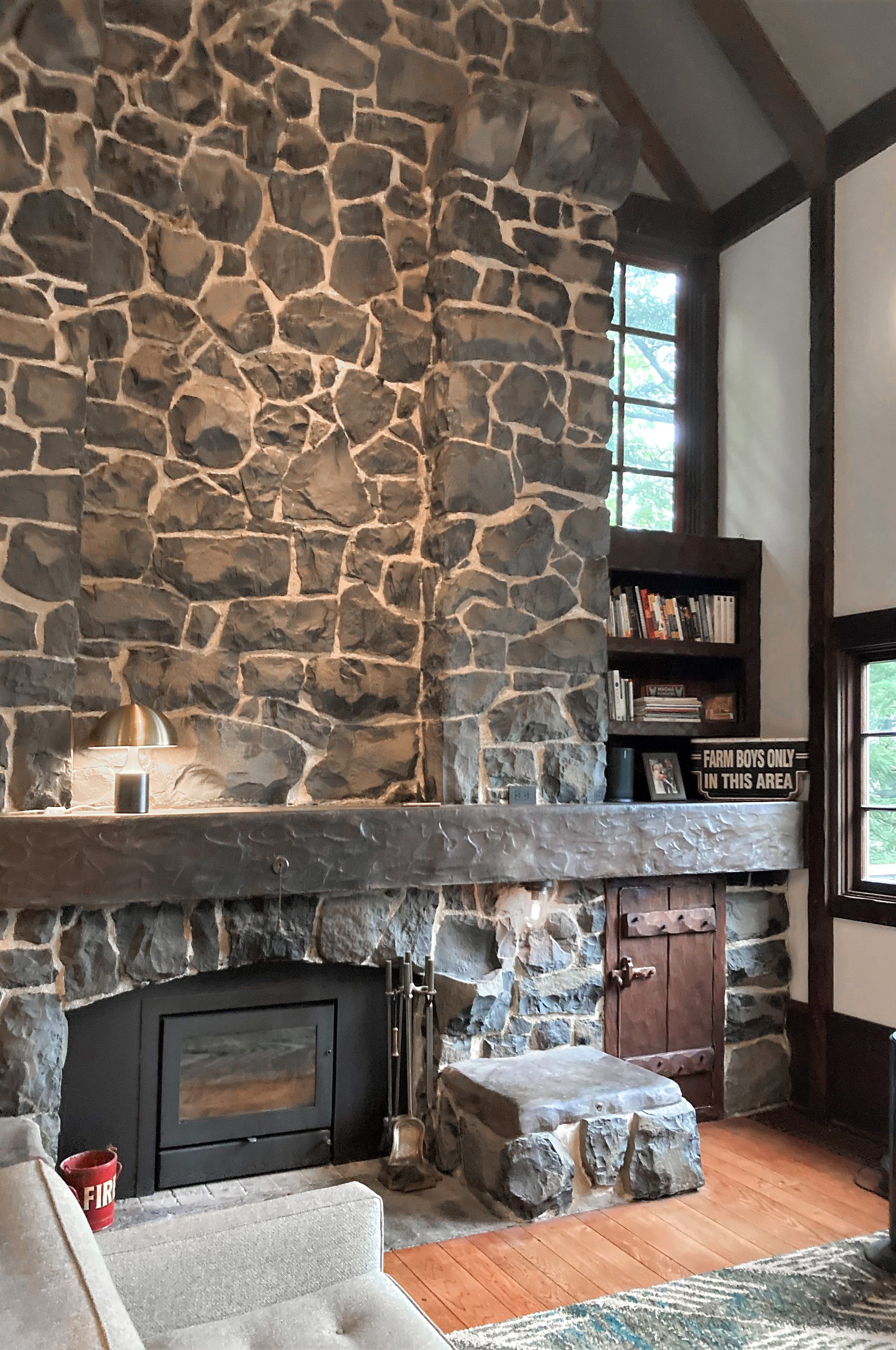 Close up of the original stone fireplace in the living room