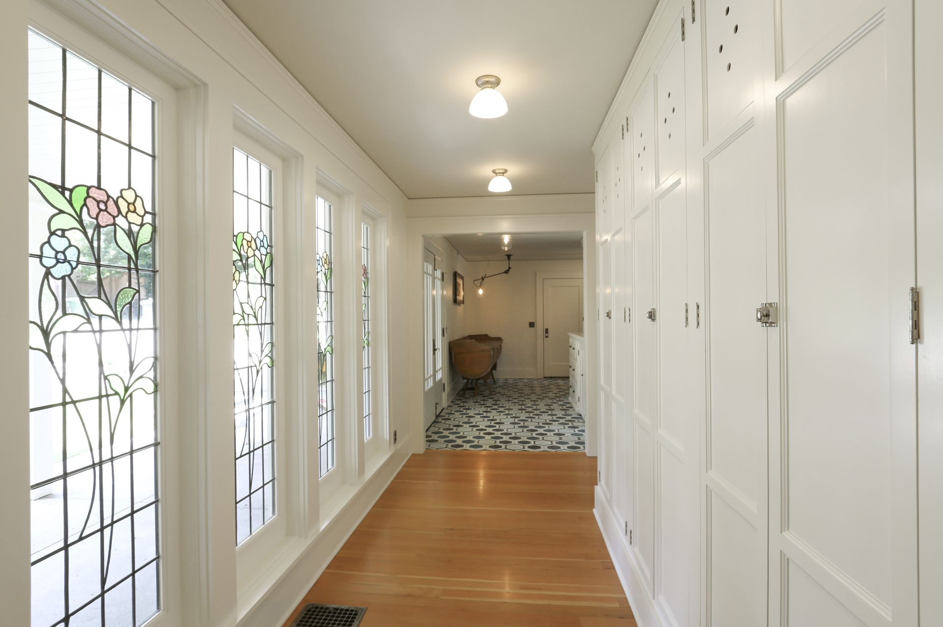 A new cabinet-lined corridor leads to the garage addition.