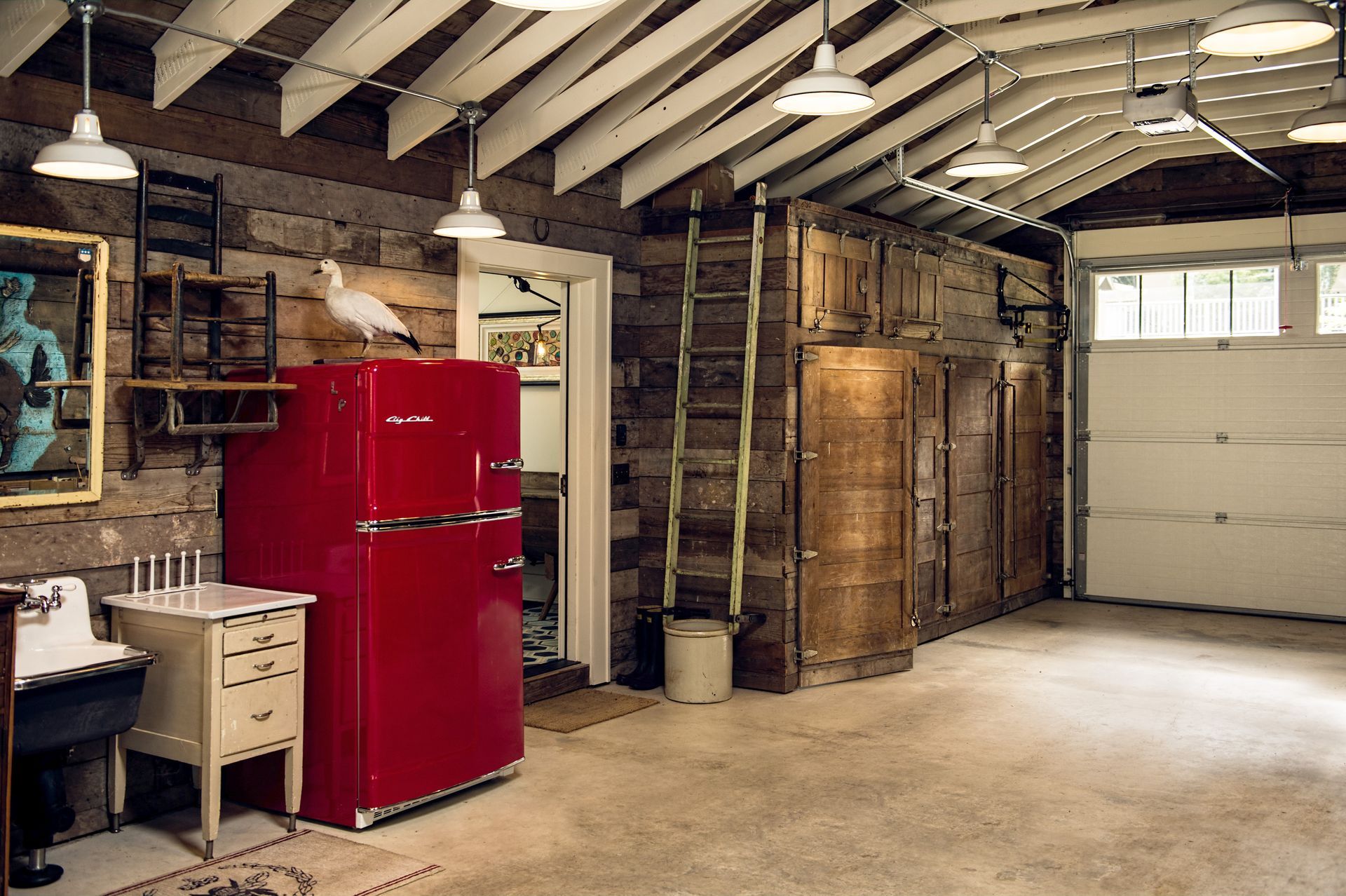 Douglas Fir shiplap boards clad the walls and ceiling, and a new scissor-truss system contrasts in a coat of white paint