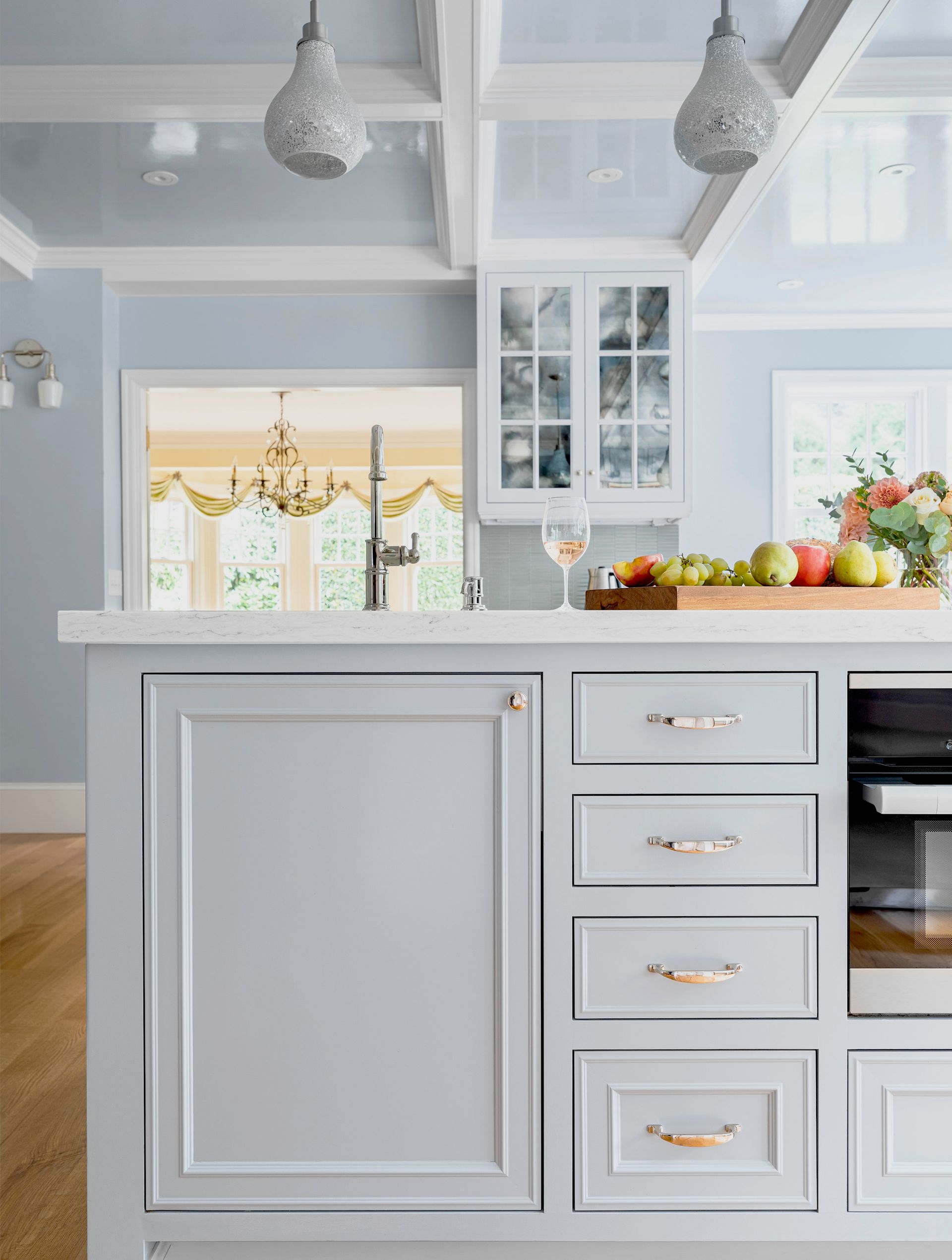 The custom island is the perfect spot to prep, catch up or have a bite to eat