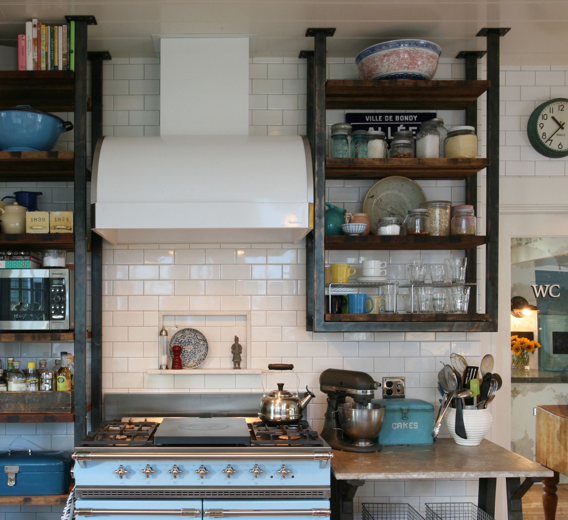 When a kitchen features as much open shelving as this one, staying organized becomes especially important. 